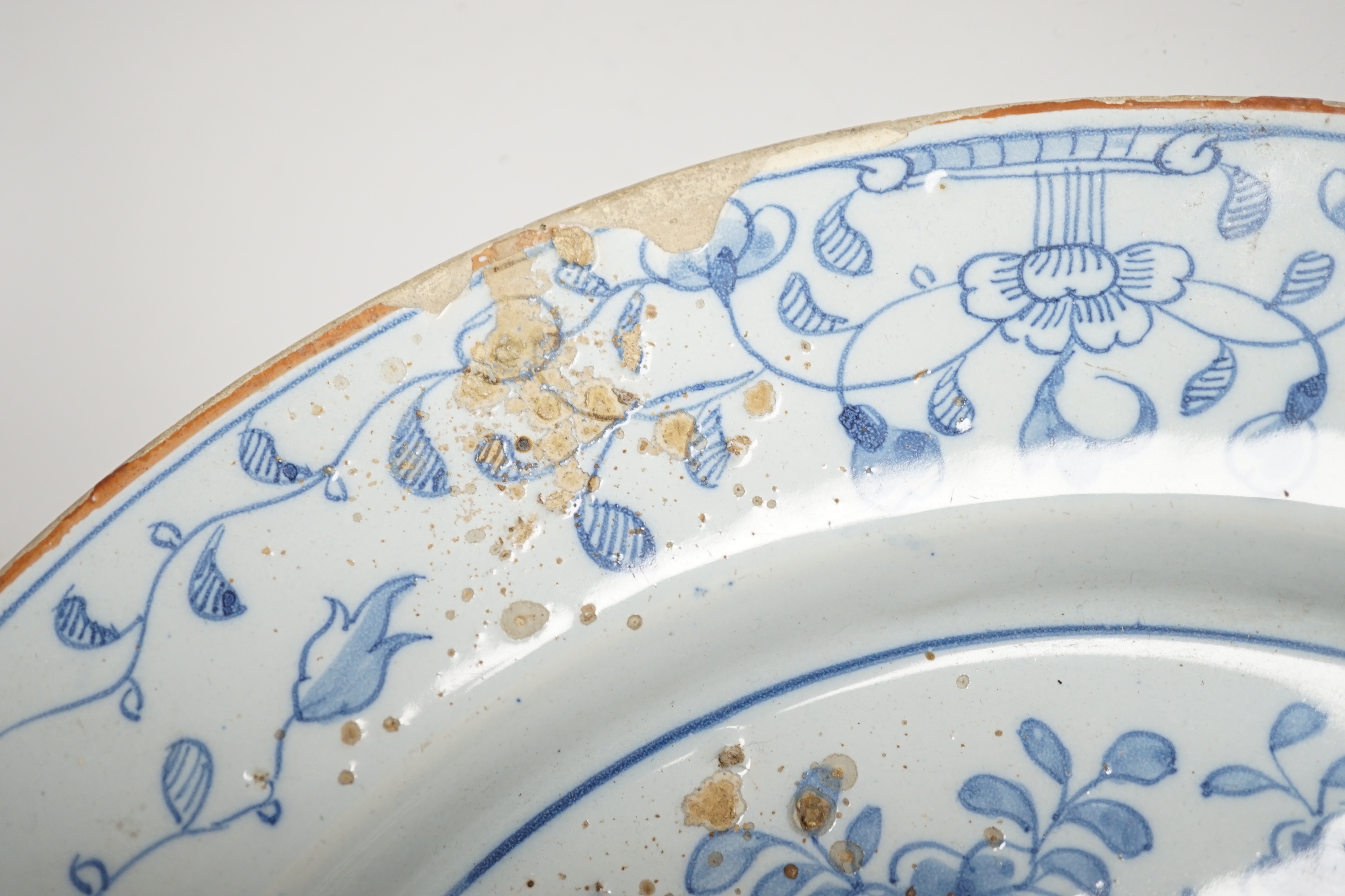 An 18th century Delft chinoiserie charger, 36cm diameter